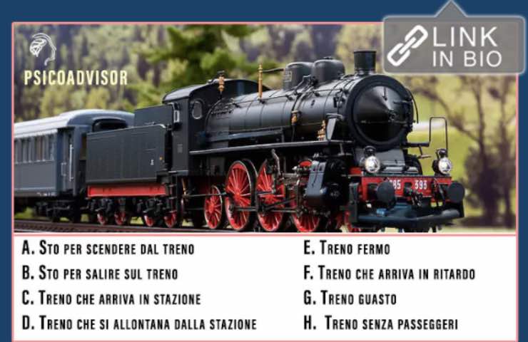 Antica locomotiva nera con rifiniture rosse in funzione